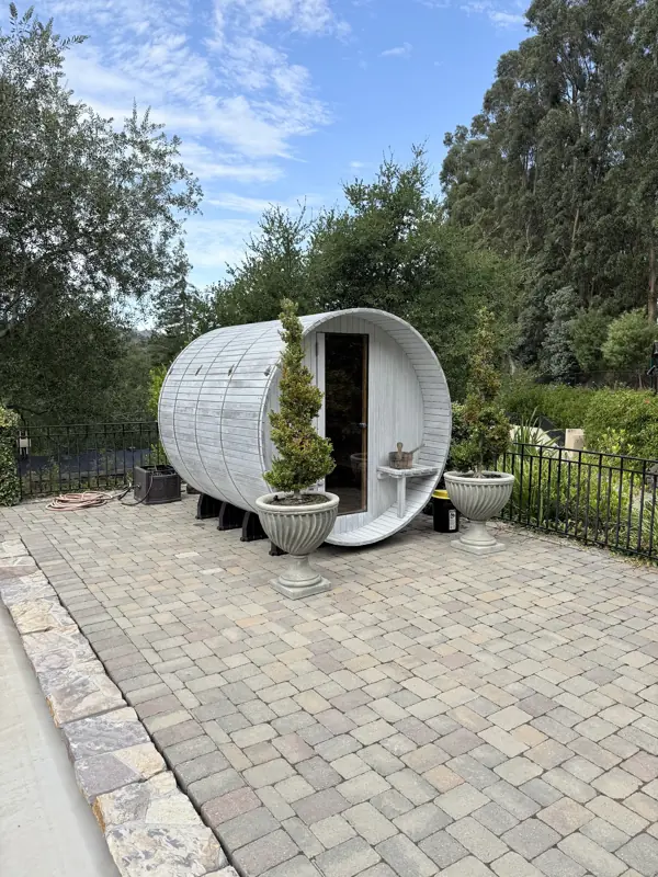 Outdoor barrel sauna on a paver terrace, Hillsborough: photograph 1