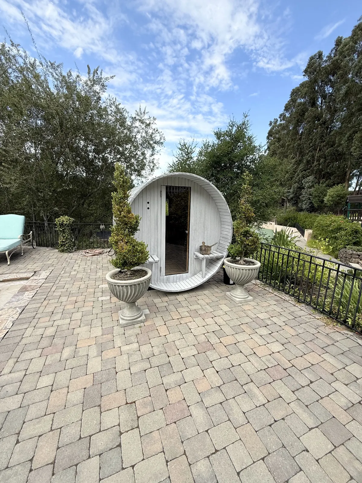 Outdoor barrel sauna on a paver terrace, Hillsborough: photograph 2