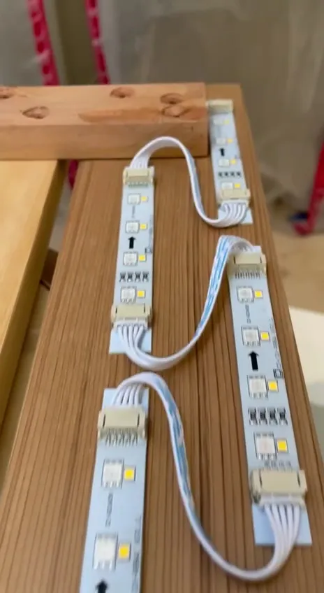 LED strips laid out before they are fitted under the benches