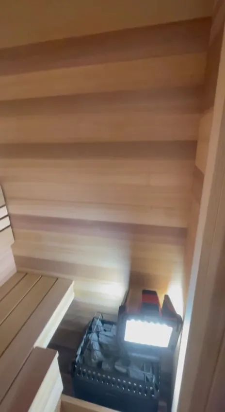 Warm light along a bench in a cedar room