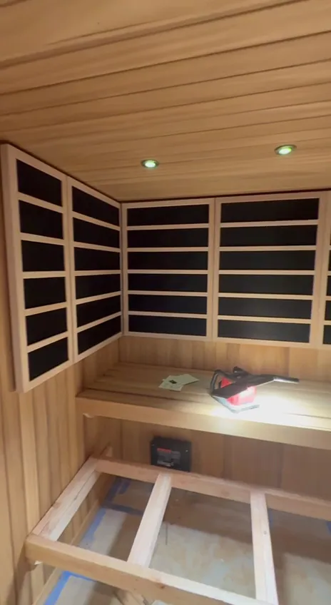 A room lined with infrared panels above the bench