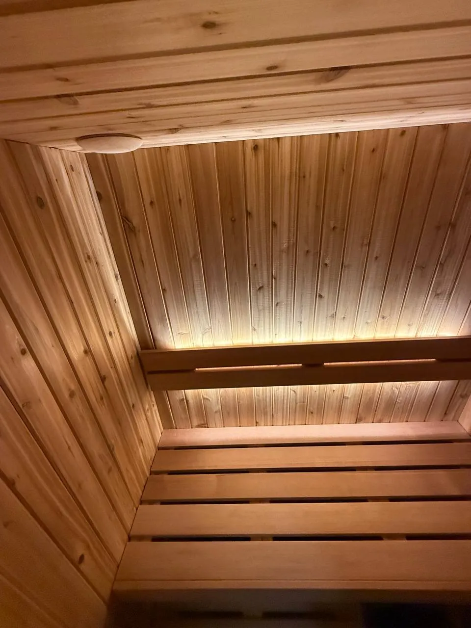 Light running under the bench and a tongue-and-groove ceiling